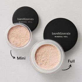 bareMinerals Mineral Veil Translucent Setting Powder with brush on a marble surface