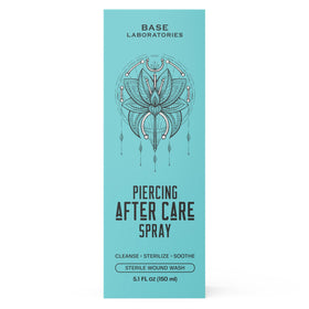 BASE LABORATORIES Piercing Aftercare Saline Spray Kit displayed on a table
