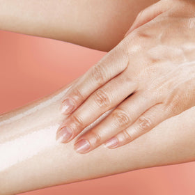 Basics Moisturizing Body Oil on a bathroom shelf