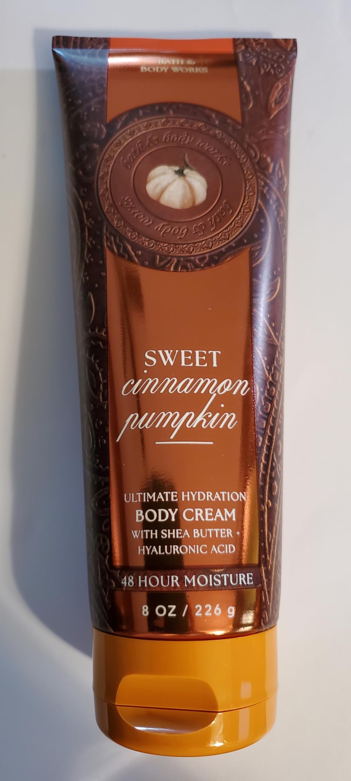 Bath & Body Works Sweet Cinnamon Pumpkin body cream on a countertop