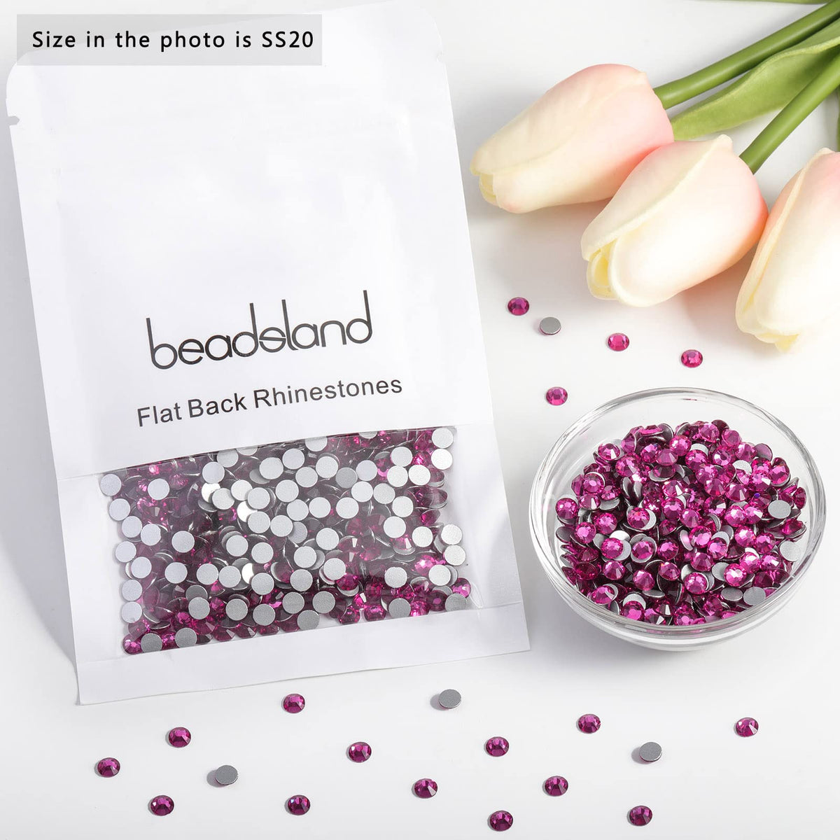 BEADSLAND Fuchsia Flat Back Rhinestones displayed on a nail art design