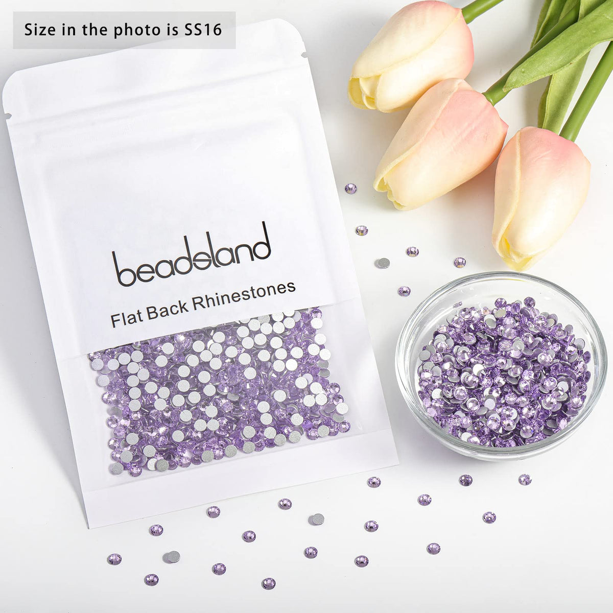 BEADSLAND Violet Rhinestones SS16 displayed on a nail art design
