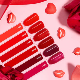 beetles Gel Polish vibrant red shades displayed on a table