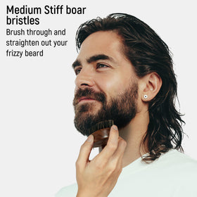 BFWood Small Travel Beard Brush in a lifestyle setting with travel bag