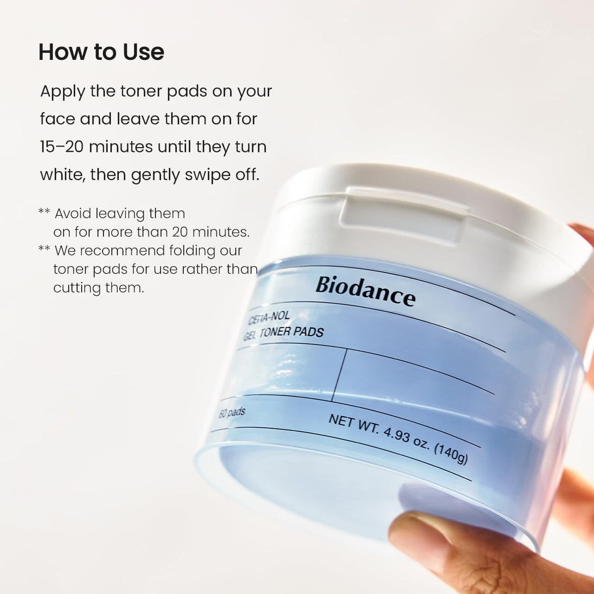 BIODANCE Cera-nol Gel Toner Pads with a hand applying the pad