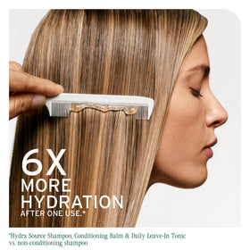 Biolage Hydra Source Detangling Solution in bathroom setting