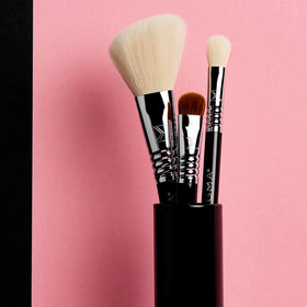 Black Brush Tin containing SIGMA BEAUTY brushes, front view