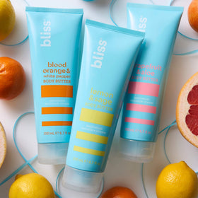 Bliss Body Butter Lotion Trio jars with natural background