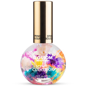 Blossom Cuticle Oil 0.5 fl. oz bottle front view with real flowers