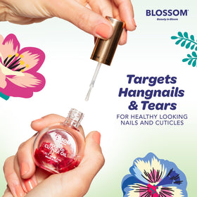 Blossom Cuticle Oil applied to nails with a floral background