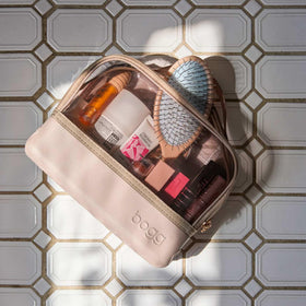 BOGG BAG Travel Organizer Pouch in a beach setting with swimsuits