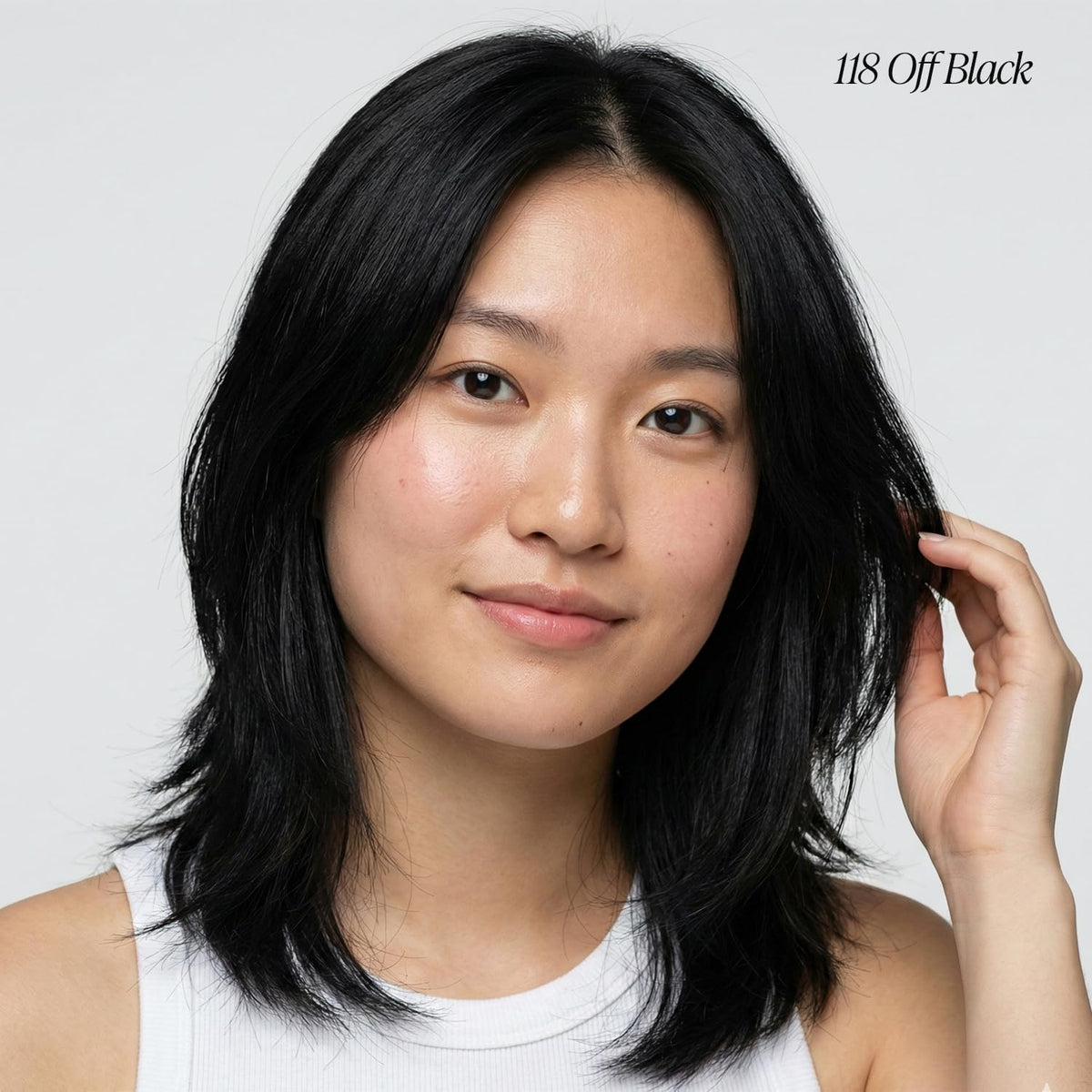 Bottle of Adore Off Black hair dye with cap