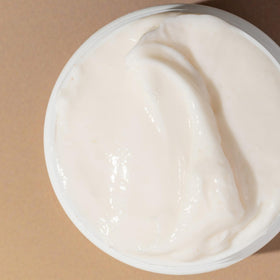 Bounce Curl Cream in a bathroom setting