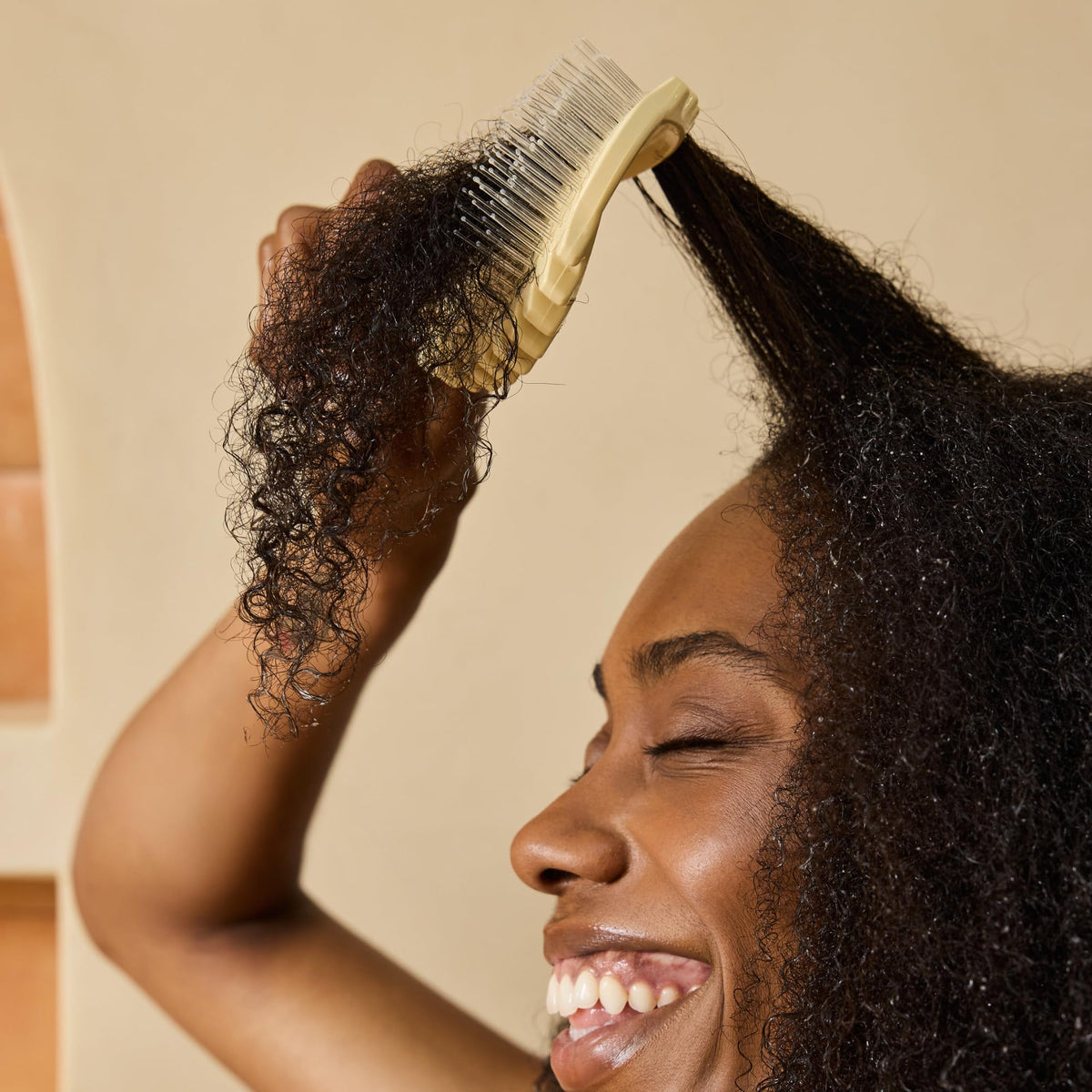 Bounce Curl Detangle Define EdgeLift Brush in a lifestyle setting