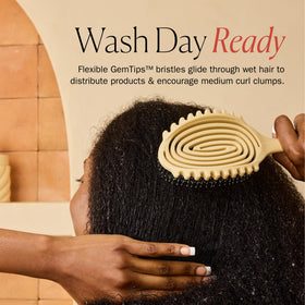 Bounce Curl Detangle Define EdgeLift Brush with water droplets for wet use