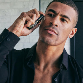 Brickell Men's Dark Circle Under Eye Serum application on skin