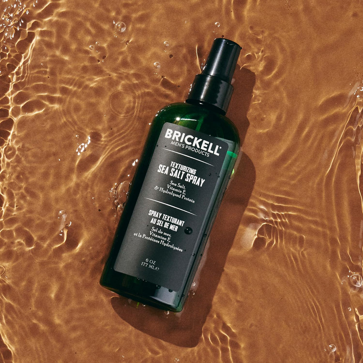 Brickell Men's Texturizing Sea Salt Spray with beach background