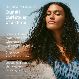 Briogeo Curl Charisma Leave-In Defining Crème on a bathroom counter