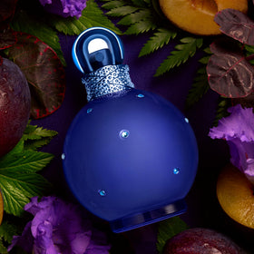Britney Spears Midnight Fantasy Eau De Parfum bottle on a nightstand