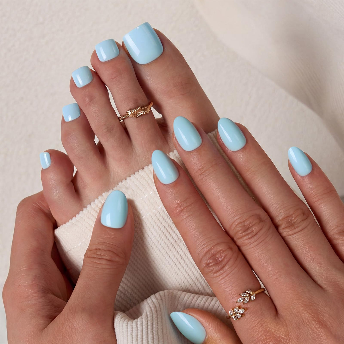 BTArtbox Press On Toenails Light Blue displayed on a hand