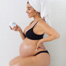 Bumpology Bump Butter 4 oz with a measuring scoop