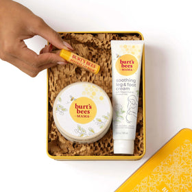 Burt's Bees belly butter being applied on a pregnant belly