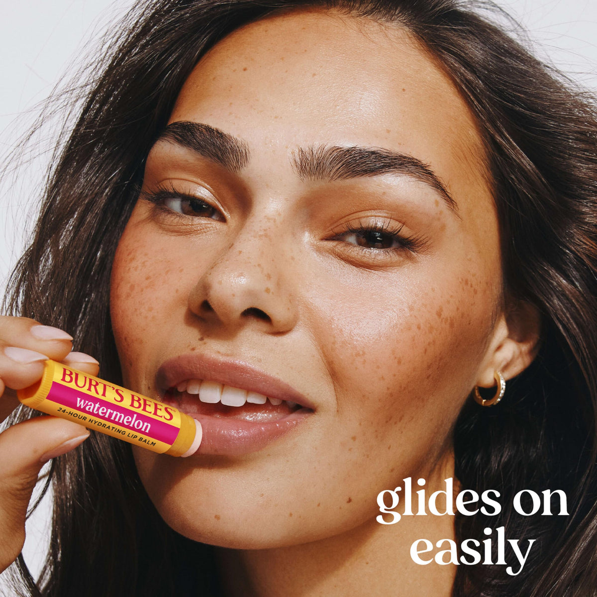 Burt's Bees Lip Balm tube in Sweet Mandarin flavour against a natural background