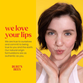 Burt's Bees lip balm tubes arranged in a garden setting