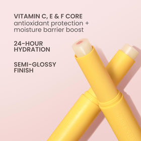 Burt's Bees support Lip Balm Sheer Plus on a wooden surface
