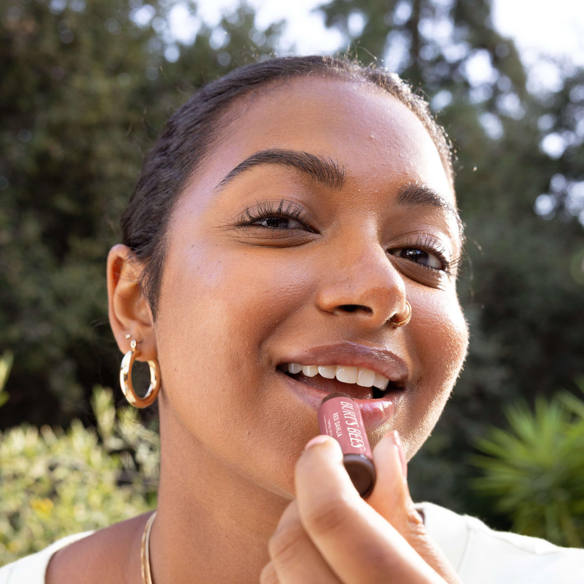 Burt's Bees Tinted Lip Balm application on lips