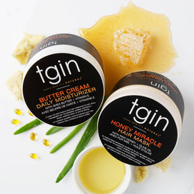 Butter Cream Daily Moisturizer and Honey Miracle Hair Mask on a bathroom shelf