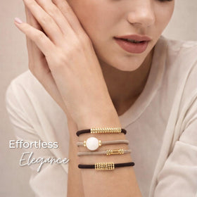 By Lilla Bracelet Hair Tie styled in a ponytail