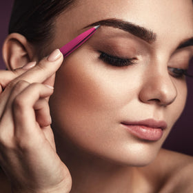 By MILLY Pointed Tweezers on a bathroom counter