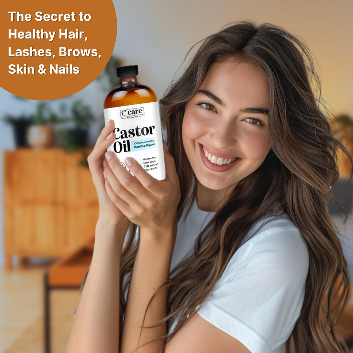 C CARE Castor Oil 100% Pure Organic Cold Pressed on a wooden table