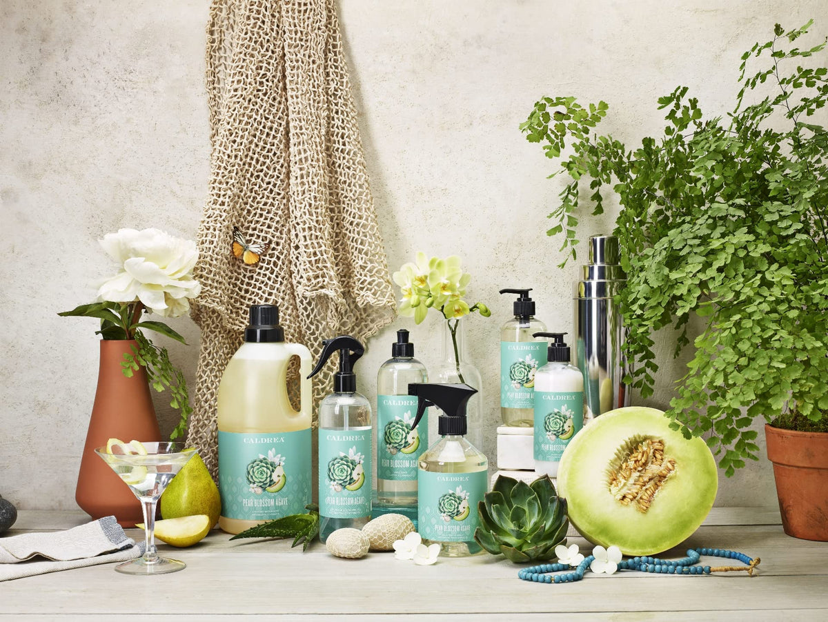 Caldrea Pear Blossom Agave Hand Soap with a floral background