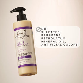Carol's Daughter Black Vanilla Moisture Conditioner on a towel