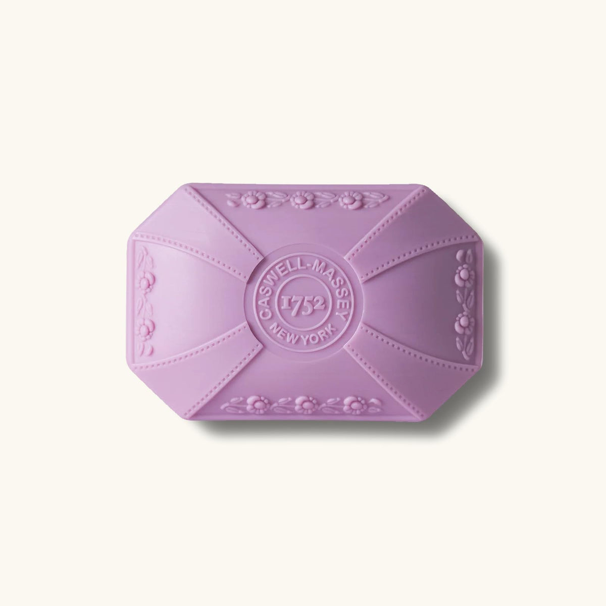 Caswell-Massey Lilac Soap bar on a marble counter