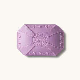 Caswell-Massey Lilac Soap bar on a marble counter