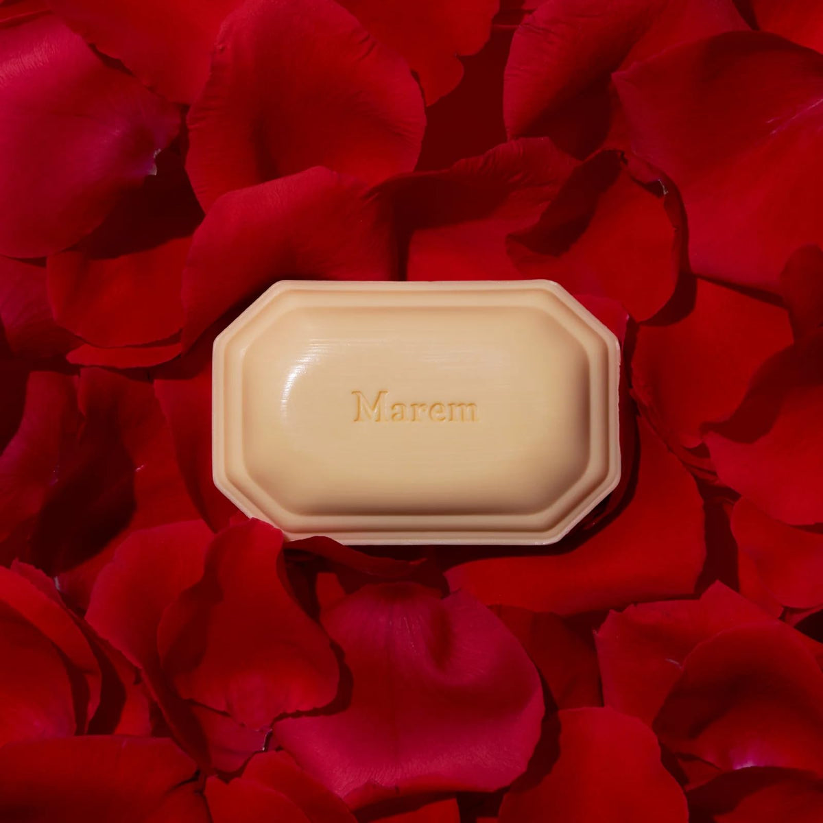 Caswell-Massey Marem soap with essential oils displayed with fresh flowers