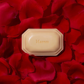 Caswell-Massey Marem soap with essential oils displayed with fresh flowers