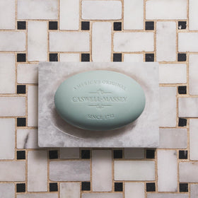 Caswell-Massey soap bar lathering on a hand