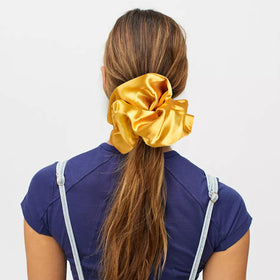 CEELGON blue satin scrunchie displayed on a table