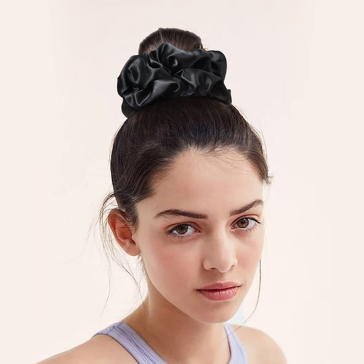 CEELGON gold satin scrunchie on a ponytail