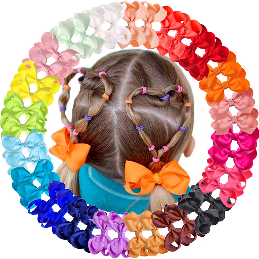 CÉLLOT hair bows laid out on a bed with accessories