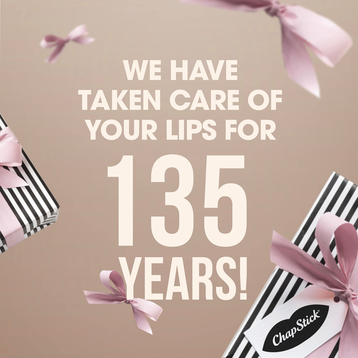 ChapStick Classic Cherry Lip Balm Tubes on a soft fabric background