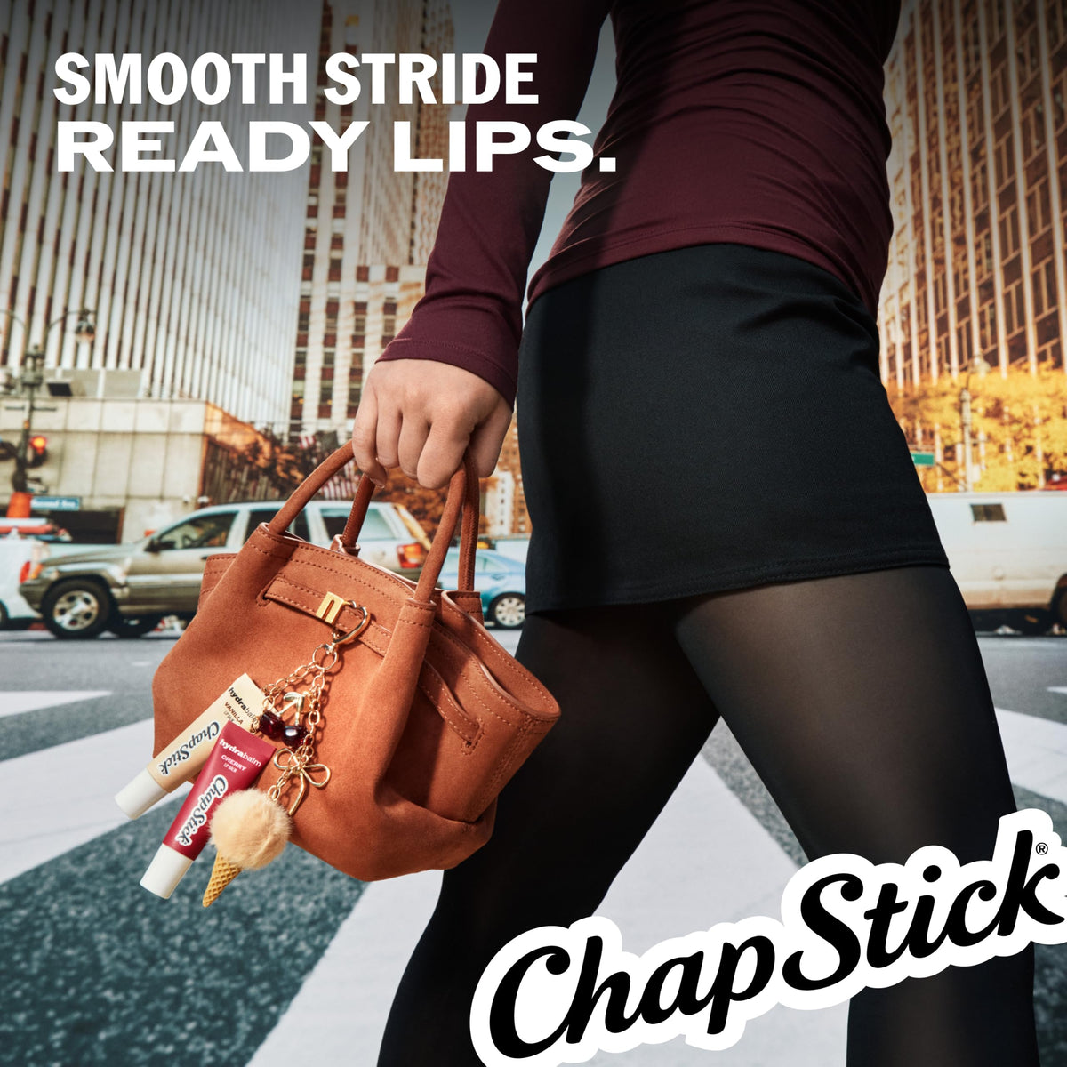 ChapStick HydraBalm tubes on a wooden surface