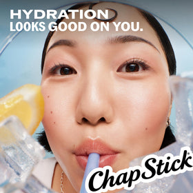 ChapStick Lip Balm Set displayed with fruits