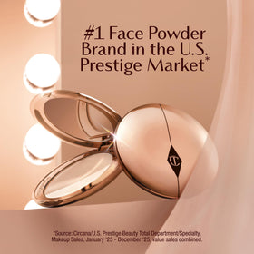 Charlotte Tilbury Airbrush Flawless Finish Blurring Powder on a vanity