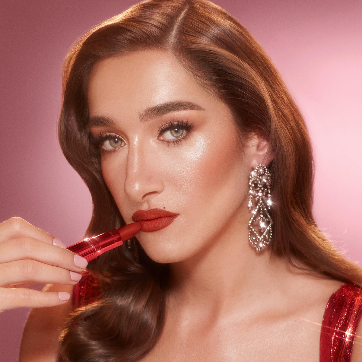 Charlotte Tilbury Matte Revolution Lipstick in a makeup bag