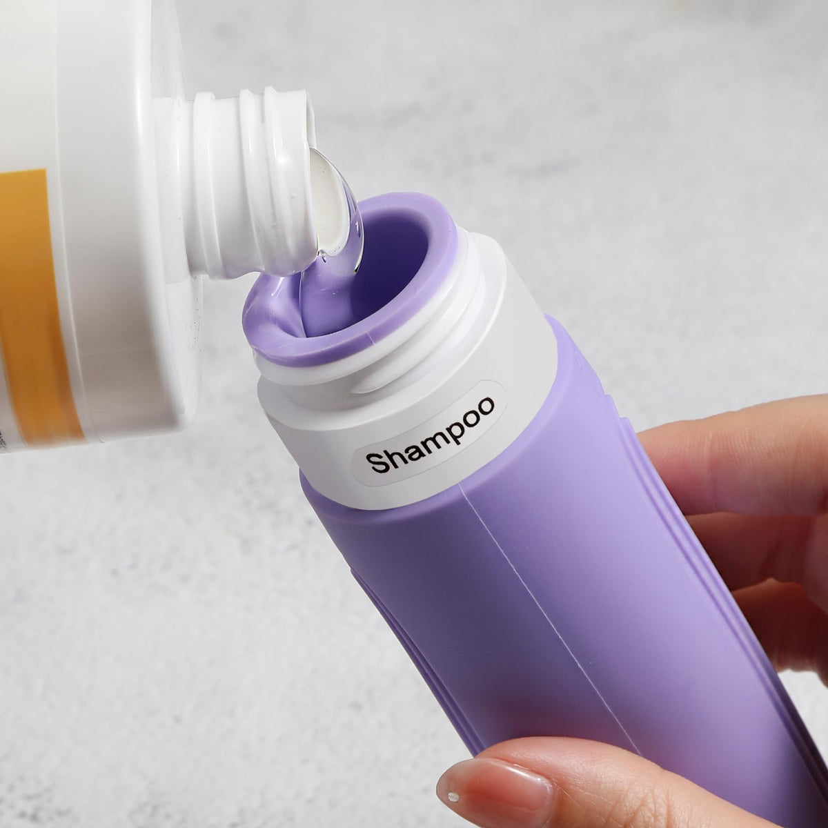 CHEODIN travel bottles showing wide opening for easy filling